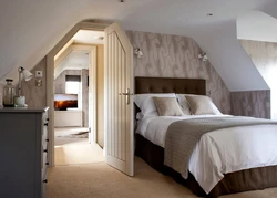 Attic bedroom with sloping ceiling design photo