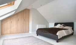 Attic bedroom with sloping ceiling design photo