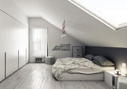 Attic bedroom with sloping ceiling design photo