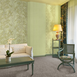 Green wallpaper for walls in the living room interior