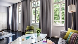 Decoration of windows in the living room in a modern style photo
