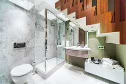 Bathroom design in a house under the stairs