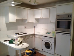 Small kitchen design with refrigerator and washing machine and gas