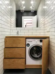 Bathroom design with vertical washing machine