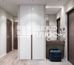 Built-in wardrobe in the hallway with hinged doors modern design photo