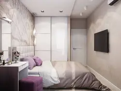 Photo of a rectangular bedroom with one window interior design