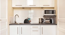 How to hang a microwave in the kitchen under the cabinets photo