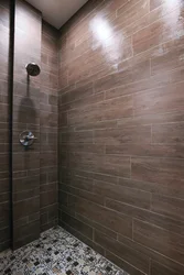 Photo Of A Bathtub With Grout Matching The Color Of The Tiles