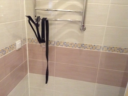 Photo of a bathtub with grout matching the color of the tiles
