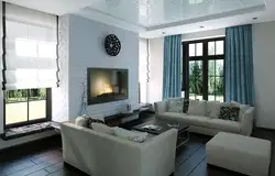 Living room interior with three windows