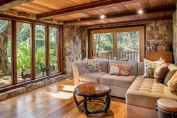 Living room with stone and wood photo