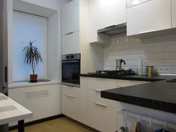 Black and white kitchen in the interior real