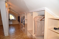 Dressing room in the attic with a sloping ceiling photo