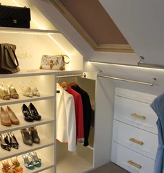 Dressing room in the attic with a sloping ceiling photo