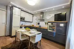 Corner kitchen with TV design in modern style