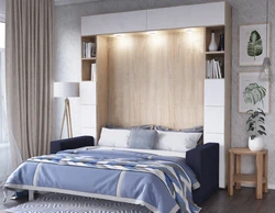 Bedroom with wardrobe at the head of the bed design