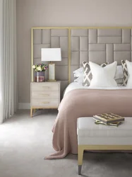 Bedroom design with a gray bed with a soft headboard