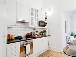 Interior white kitchen and brick