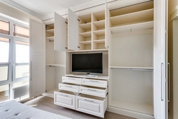 Living room interior with a full-wall closet