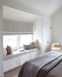 Bedroom design with furniture by the window