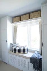 Bedroom design with furniture by the window