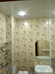 Bath design made of plastic panels and tiles