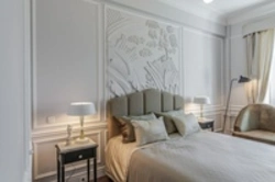 Molding above the bed in the bedroom photo