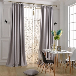 Gray beige curtains in the kitchen interior