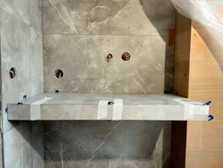 Countertop in the bathroom under the sink made of porcelain stoneware photo