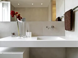 Countertop in the bathroom under the sink made of porcelain stoneware photo