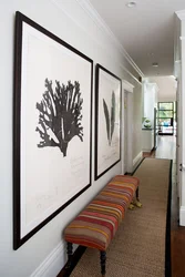 Paintings in a small hallway interior