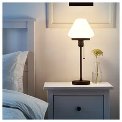 Lamps on the bedside table in the bedroom photo