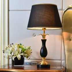 Lamps on the bedside table in the bedroom photo