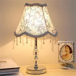Lamps On The Bedside Table In The Bedroom Photo