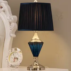 Lamps on the bedside table in the bedroom photo