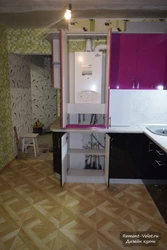 Kitchen interior with gas boiler on the floor