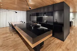 Black kitchen in the living room interior