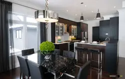 Black kitchen in the living room interior
