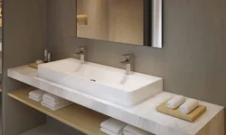 Washbasin on the countertop in the bath photo