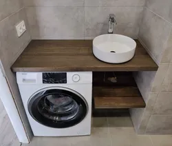 Washbasin on the countertop in the bath photo