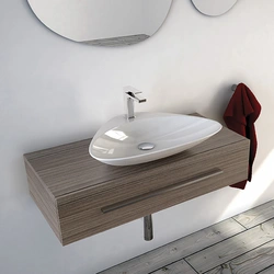 Washbasin on the countertop in the bath photo