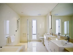 Bathtub combined with toilet with window photo