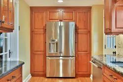 Built-in refrigerator in the kitchen interior photo