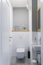 Interior Of A Toilet With A Sink Without A Bathtub