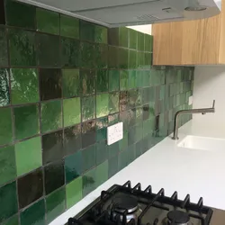 Kitchen design with green tiles