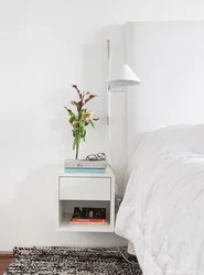 Photo of hanging bedside tables in the bedroom