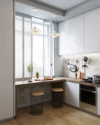 Design of a small kitchen with a window in an apartment