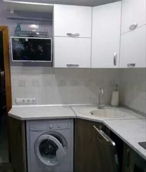 Corner kitchen design with refrigerator and washing machine photo