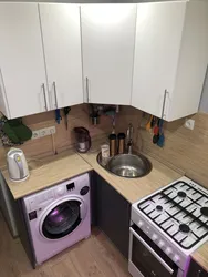 Corner kitchen design with refrigerator and washing machine photo