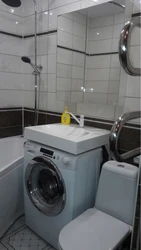 Дызайн ваннага пакоя з пральнай машынай і воданагравальнікам